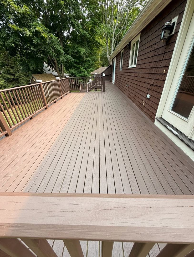 Deck Refinishing Staining – After 1 Refinished deck with fresh stain on decking and railings