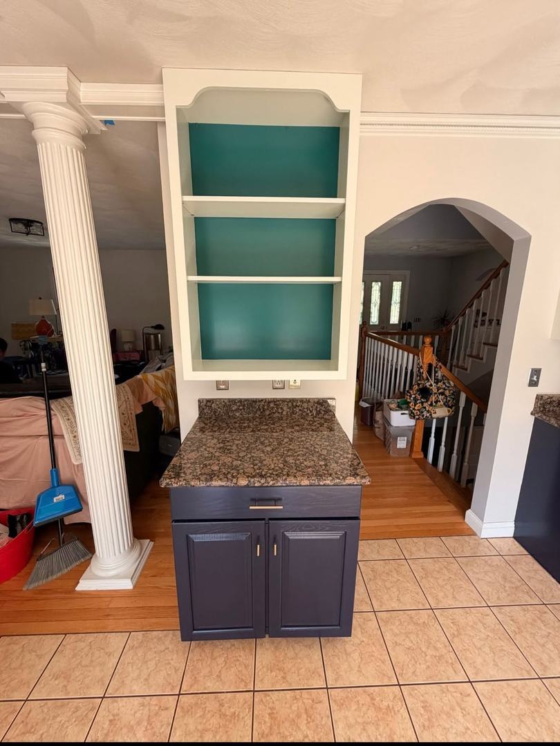 Kitchen Cabinet Painting – After 5 White built-in shelving with teal interior and painted navy cabinet below