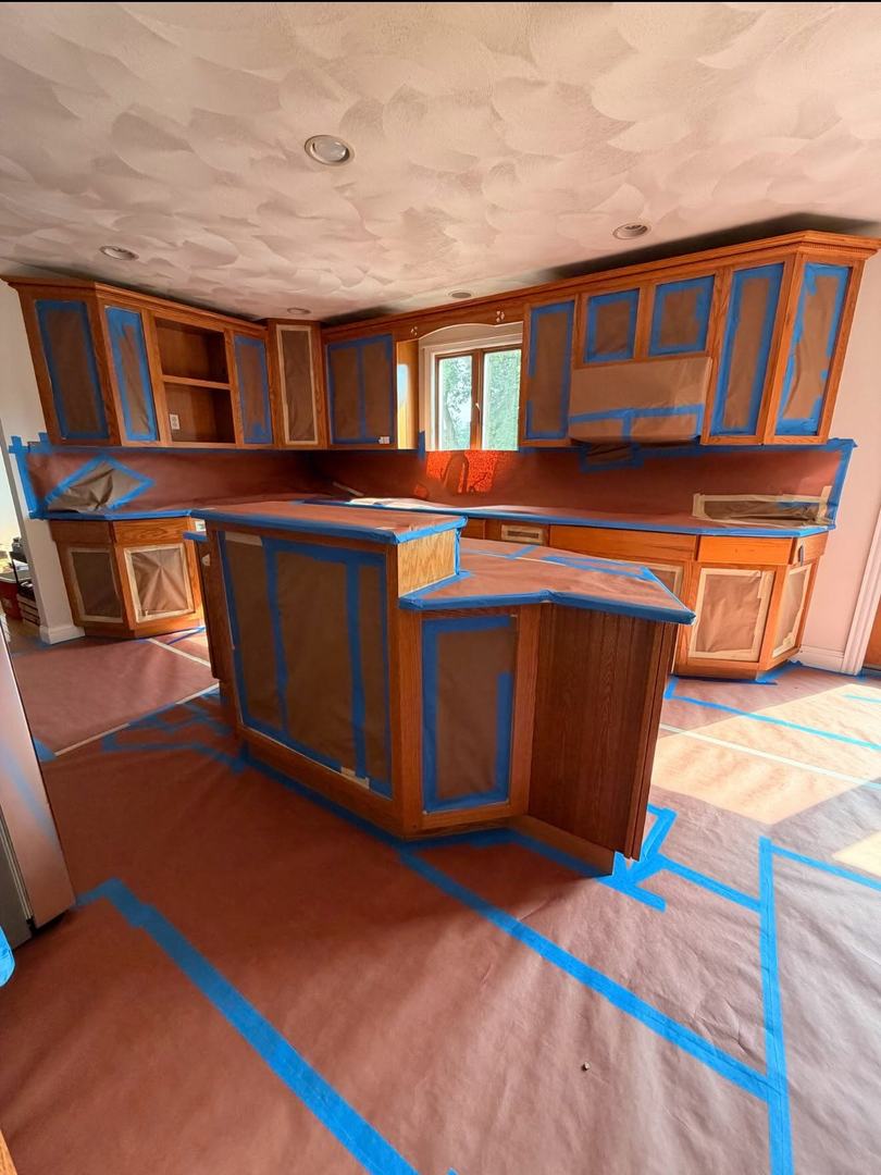 Kitchen Cabinet Painting – Before 1 Dated oak kitchen cabinets and island masked off before cabinet painting